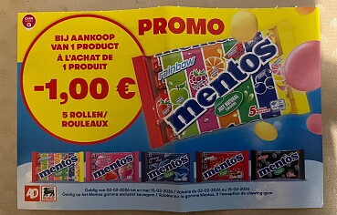 Coupon Mentos aan rek bij Delhaize